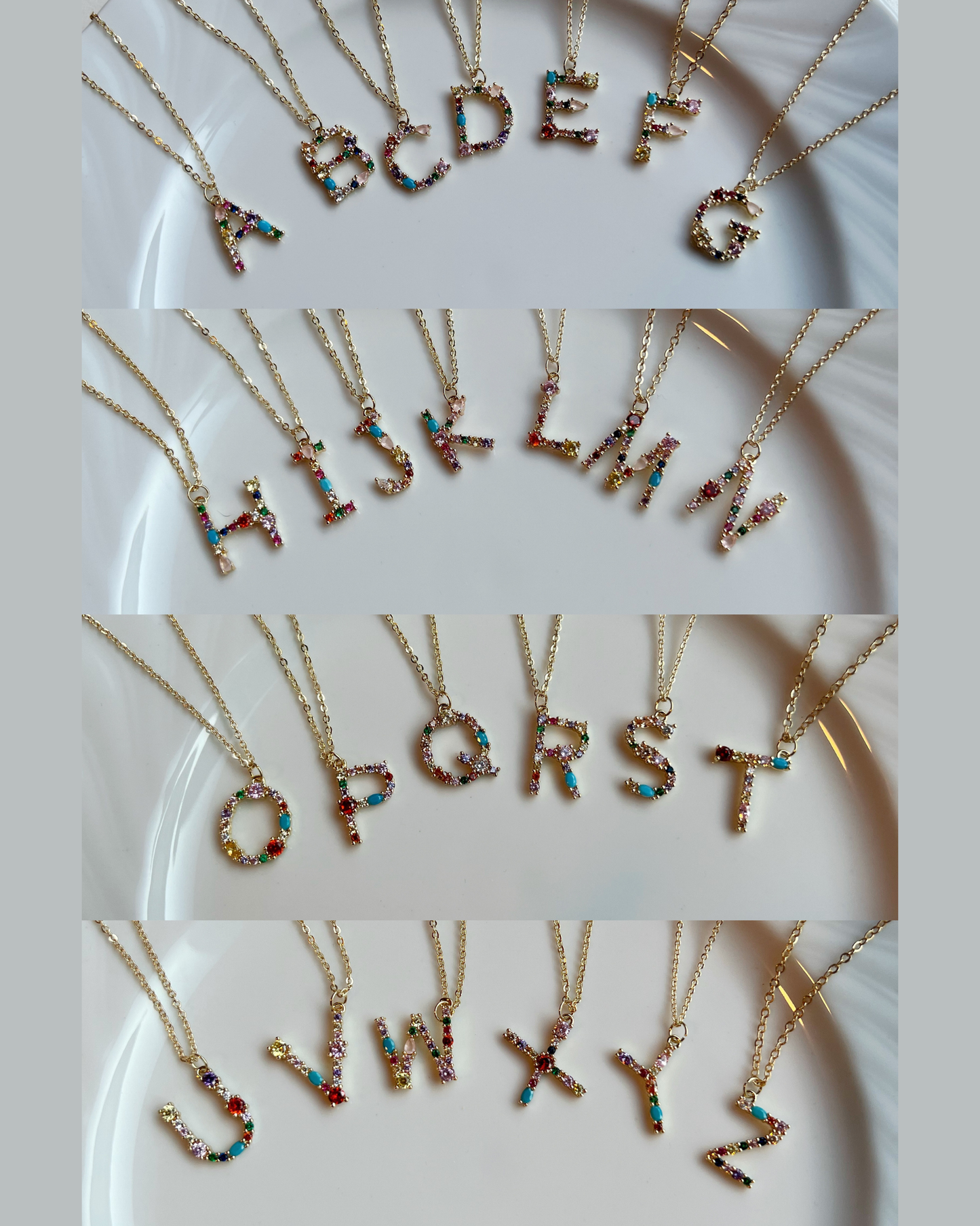 Necklaces with colorful letter pendants on a white plate